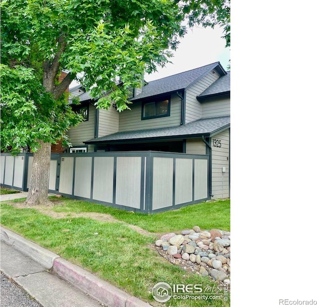 1325 Birch St Unit 12, Fort Collins, CO 80521 - rear view of house featuring a shingled roof