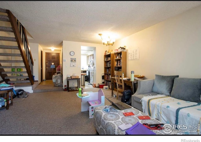 1325 Birch St Unit 12, Fort Collins, CO 80521 - living area with carpet flooring, stairs, a chandelier, and a textured ceiling
