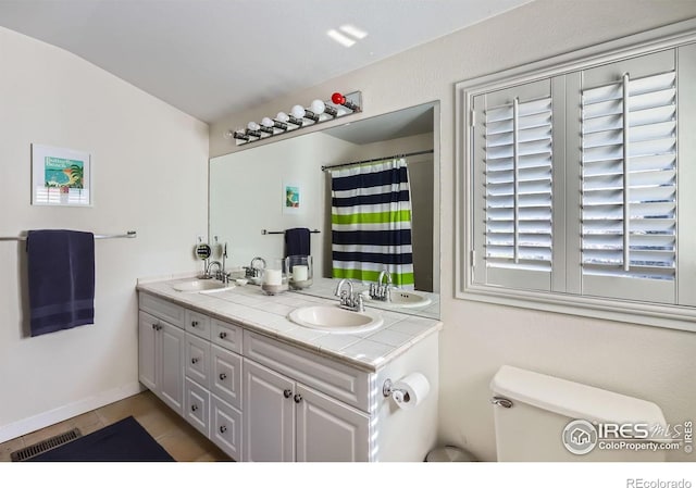 1149 Quince Ave, Boulder, CO 80304 - full bath with double vanity, lofted ceiling, and tile patterned flooring