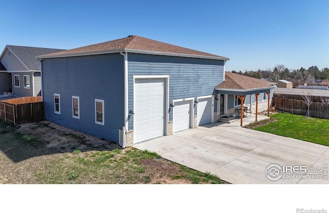 1403 Crestridge Dr, Loveland, CO 80537 - rear view of house with a shingled roof