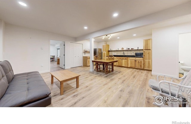 1403 Crestridge Dr, Loveland, CO 80537 - living area with light wood-style floors and recessed lighting