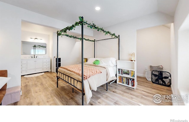1403 Crestridge Dr, Loveland, CO 80537 - bedroom featuring wood finished floors, recessed lighting, and lofted ceiling
