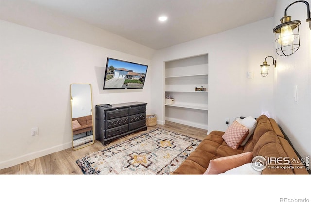 1403 Crestridge Dr, Loveland, CO 80537 - living area with built in features and wood finished floors