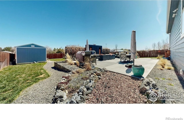 1403 Crestridge Dr, Loveland, CO 80537 - fenced backyard featuring a storage unit and a patio area