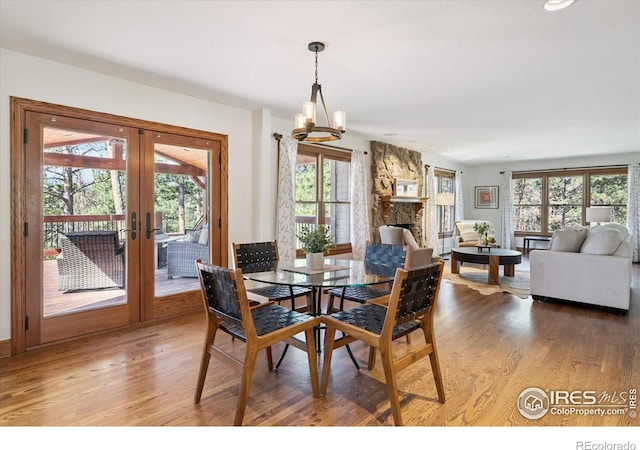 2023 Mammoth Ct, Evergreen, CO 80439 - dining space featuring french doors, healthy amount of natural light, and wood finished floors