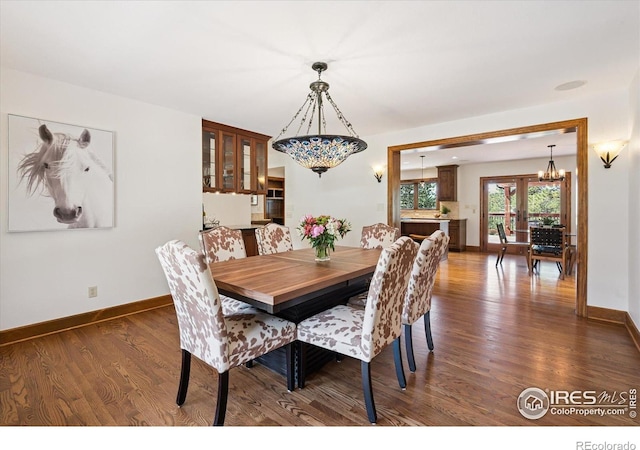 2023 Mammoth Ct, Evergreen, CO 80439 - dining space with dark wood finished floors and a chandelier
