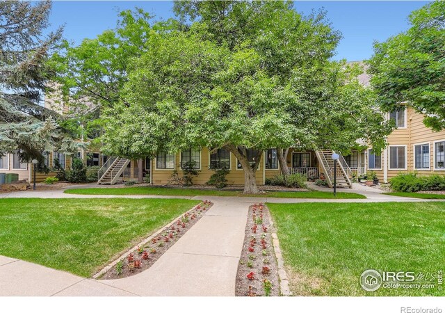 5918 Gunbarrel Ave Unit B, Boulder, CO 80301 - view of property hidden behind natural elements with stairway and a front lawn