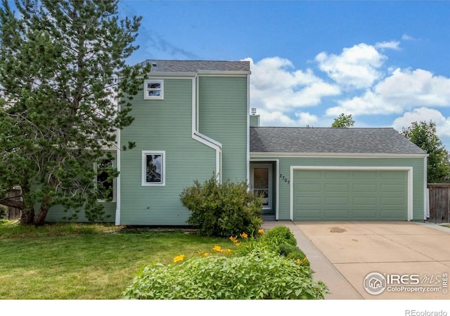 2707 W Stuart St, Fort Collins, CO 80526 - view of front of house with a garage, concrete driveway, and a front lawn