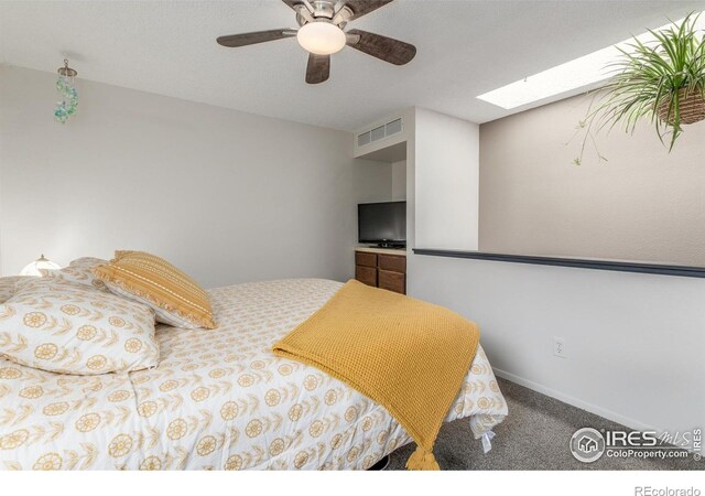 2707 W Stuart St, Fort Collins, CO 80526 - carpeted bedroom with a skylight and ceiling fan