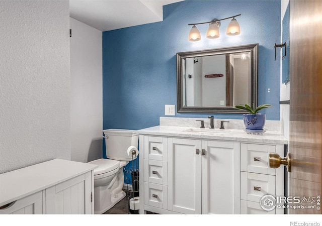 2707 W Stuart St, Fort Collins, CO 80526 - bathroom featuring vanity and a textured wall