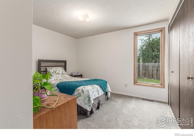 2707 W Stuart St, Fort Collins, CO 80526 - bedroom with carpet flooring and a textured ceiling