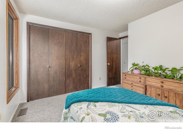 2707 W Stuart St, Fort Collins, CO 80526 - carpeted bedroom with a closet and a textured ceiling