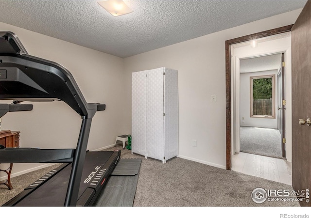 2707 W Stuart St, Fort Collins, CO 80526 - exercise area featuring carpet and a textured ceiling