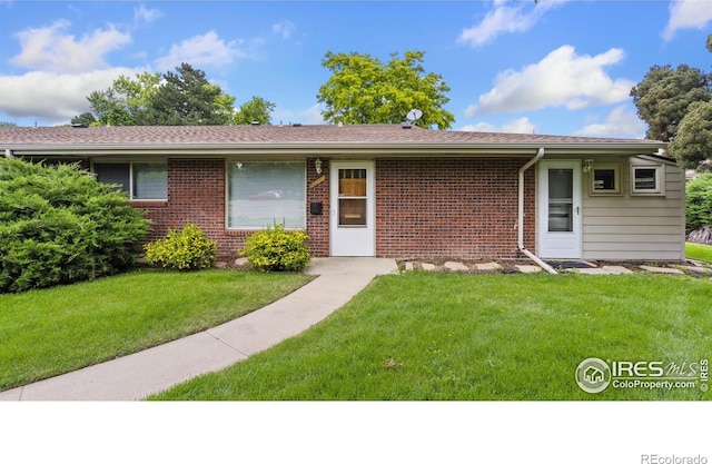 416 E Thunderbird Dr, Fort Collins, CO 80525 - ranch-style house with brick siding and a front yard