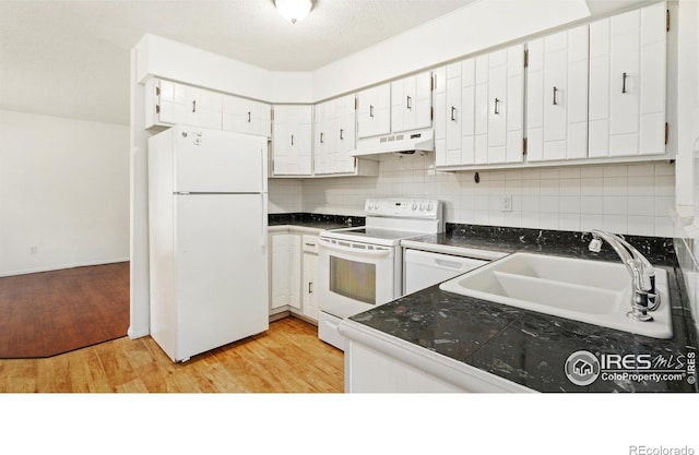 416 E Thunderbird Dr, Fort Collins, CO 80525 - kitchen with white appliances, under cabinet range hood, dark countertops, white cabinets, and light wood finished floors