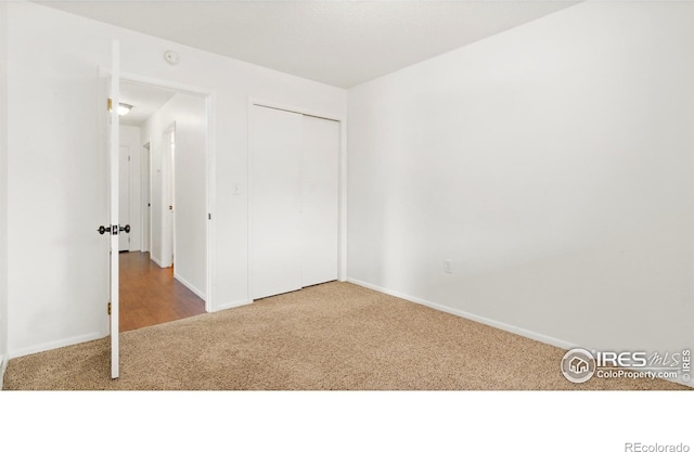 416 E Thunderbird Dr, Fort Collins, CO 80525 - unfurnished bedroom featuring carpet and a closet