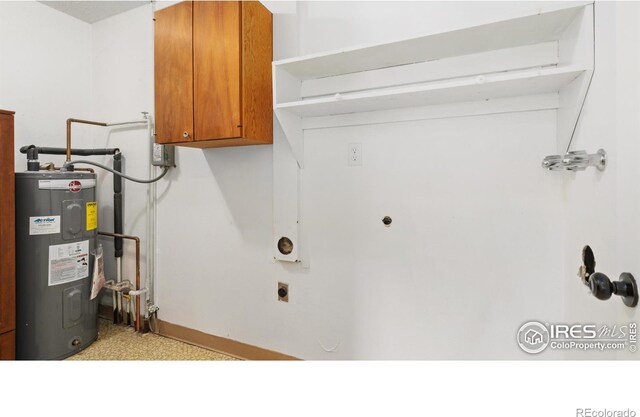 416 E Thunderbird Dr, Fort Collins, CO 80525 - washroom with water heater, cabinet space, electric dryer hookup, and light carpet