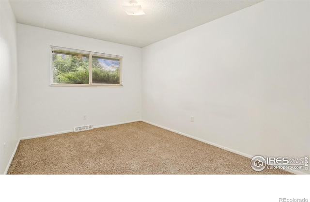 416 E Thunderbird Dr, Fort Collins, CO 80525 - carpeted empty room with baseboards and a textured ceiling