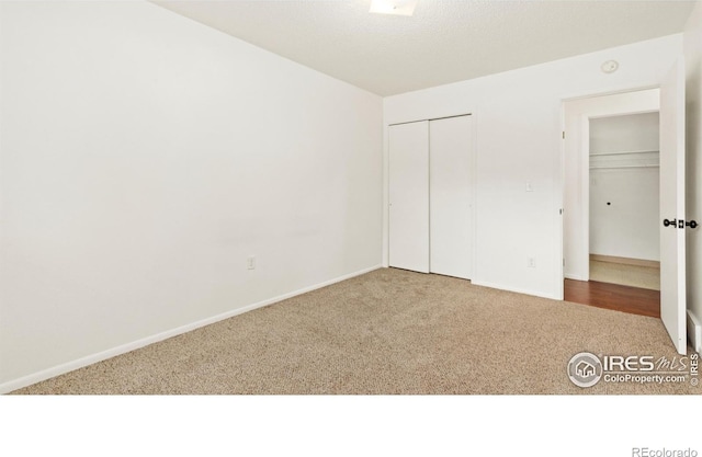 416 E Thunderbird Dr, Fort Collins, CO 80525 - unfurnished bedroom featuring carpet flooring and a closet