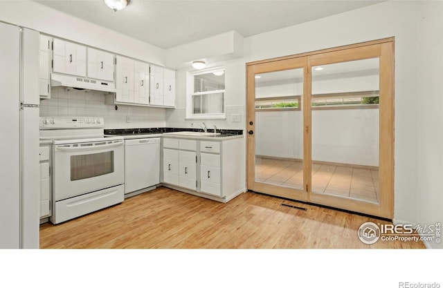 416 E Thunderbird Dr, Fort Collins, CO 80525 - kitchen with white appliances, under cabinet range hood, white cabinetry, light wood-style flooring, and backsplash