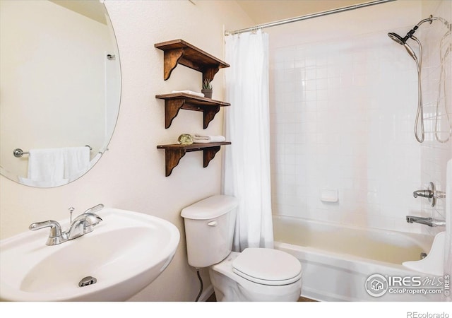 1122 Olympia Ave Unit 12H, Longmont, CO 80504 - full bath featuring a sink and shower / bath combo with shower curtain