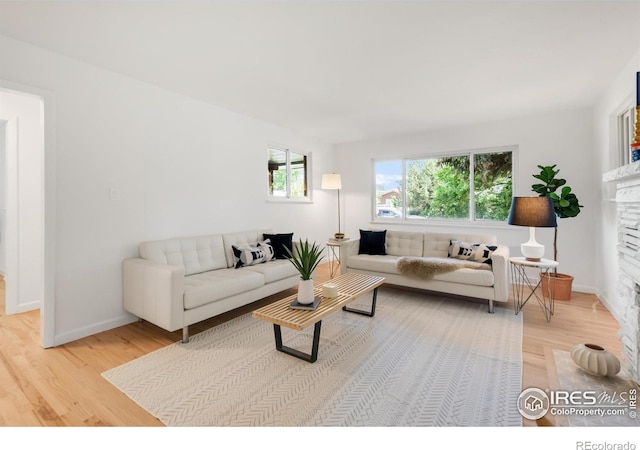 2025 Grape Ave, Boulder, CO 80304 - living room featuring light wood finished floors and a fireplace