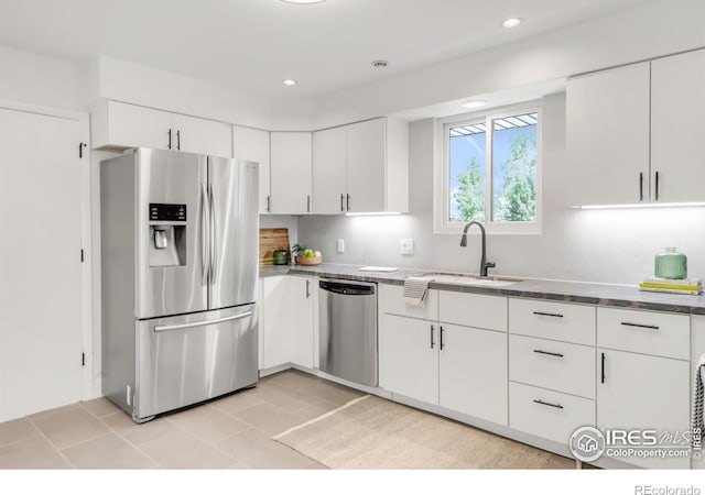 2025 Grape Ave, Boulder, CO 80304 - kitchen featuring stainless steel appliances, white cabinets, light tile patterned floors, recessed lighting, and stone countertops