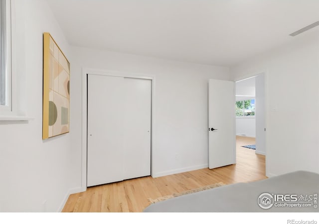2025 Grape Ave, Boulder, CO 80304 - unfurnished bedroom with wood finished floors and a closet