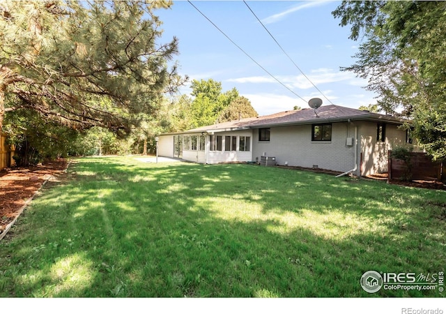 2025 Grape Ave, Boulder, CO 80304 - view of green lawn with a sunroom