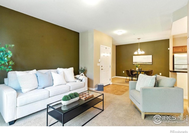 2450 Windrow Dr Unit E106, Fort Collins, CO 80525 - living room with a chandelier and light colored carpet