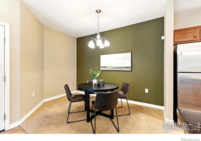 2450 Windrow Dr Unit E106, Fort Collins, CO 80525 - dining room featuring light carpet and a chandelier