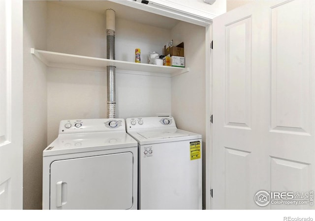 2450 Windrow Dr Unit E106, Fort Collins, CO 80525 - laundry area with independent washer and dryer