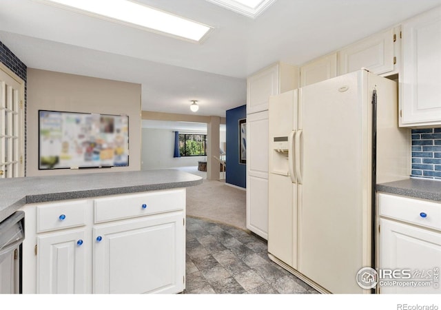 1323 Horizon Ln, Longmont, CO 80501 - kitchen featuring white refrigerator with ice dispenser, dishwasher, tasteful backsplash, open floor plan, and white cabinetry