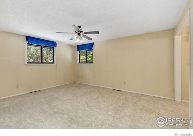 1323 Horizon Ln, Longmont, CO 80501 - empty room with carpet flooring, ceiling fan, and a textured ceiling