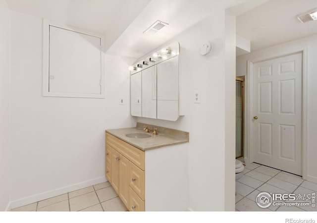 1323 Horizon Ln, Longmont, CO 80501 - bathroom featuring tile patterned floors, vanity, and a shower with door