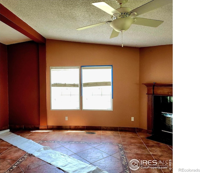 18082 County Road 25, Brush, CO 80723 - unfurnished living room with a ceiling fan and a textured ceiling