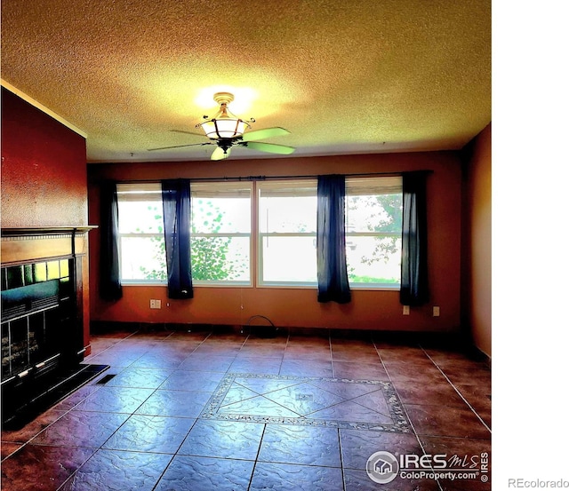 18082 County Road 25, Brush, CO 80723 - unfurnished living room with ceiling fan and a textured ceiling