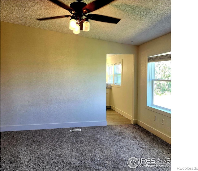 18082 County Road 25, Brush, CO 80723 - carpeted spare room with ceiling fan and a textured ceiling