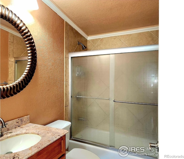 18082 County Road 25, Brush, CO 80723 - full bath featuring a textured wall, vanity, crown molding, combined bath / shower with glass door, and a textured ceiling