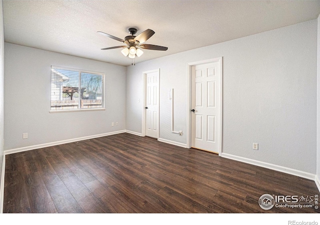 3536 38th Ave, Evans, CO 80620 - unfurnished bedroom with dark wood finished floors and ceiling fan