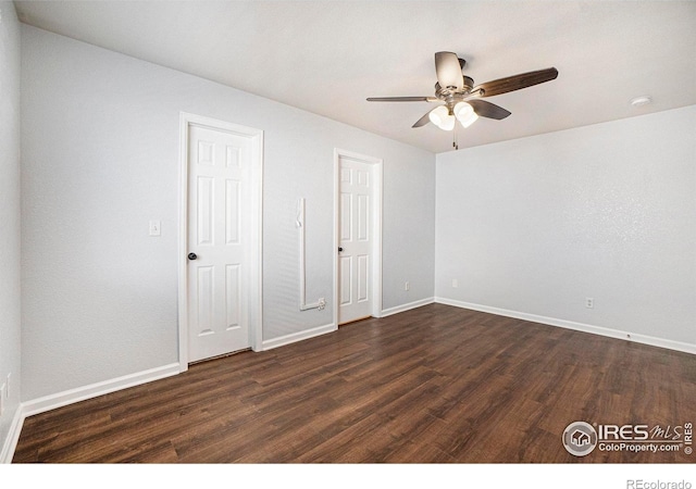 3536 38th Ave, Evans, CO 80620 - unfurnished bedroom with dark wood-style floors and ceiling fan