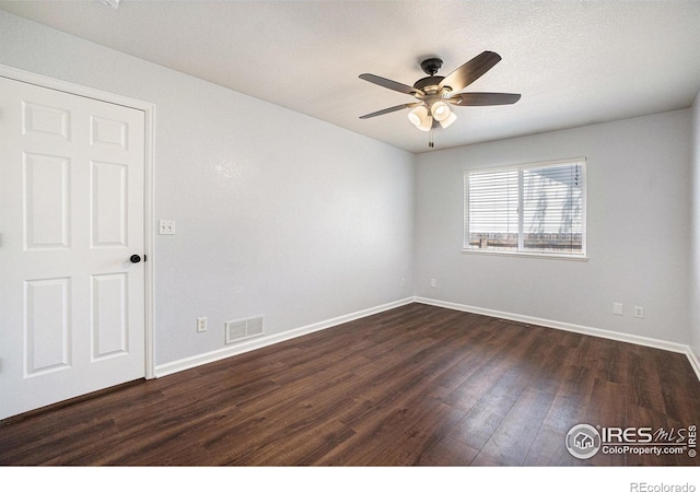 3536 38th Ave, Evans, CO 80620 - unfurnished room with dark wood-style flooring and a ceiling fan