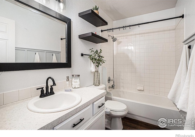 3536 38th Ave, Evans, CO 80620 - bathroom featuring vanity,  shower combination, and wood finished floors