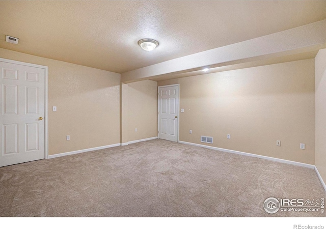 3536 38th Ave, Evans, CO 80620 - carpeted spare room featuring a textured ceiling and baseboards