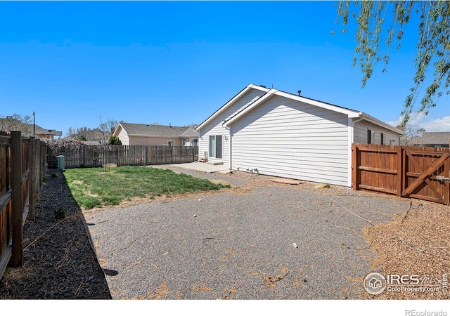 3536 38th Ave, Evans, CO 80620 - back of house with a patio area and a fenced backyard