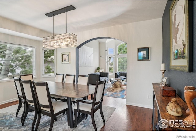 345 Onyx Way, Superior, CO 80027 - dining area with wood finished floors and arched walkways