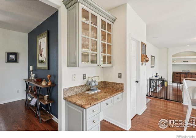 345 Onyx Way, Superior, CO 80027 - bar featuring wood finished floors, built in shelves, and arched walkways