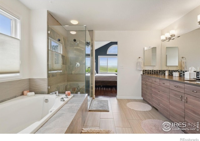 345 Onyx Way, Superior, CO 80027 - ensuite bathroom with vanity, a bath, and a stall shower