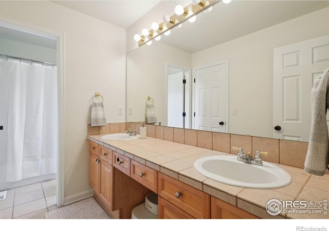 345 Onyx Way, Superior, CO 80027 - full bathroom with double vanity, tile patterned flooring, and curtained shower