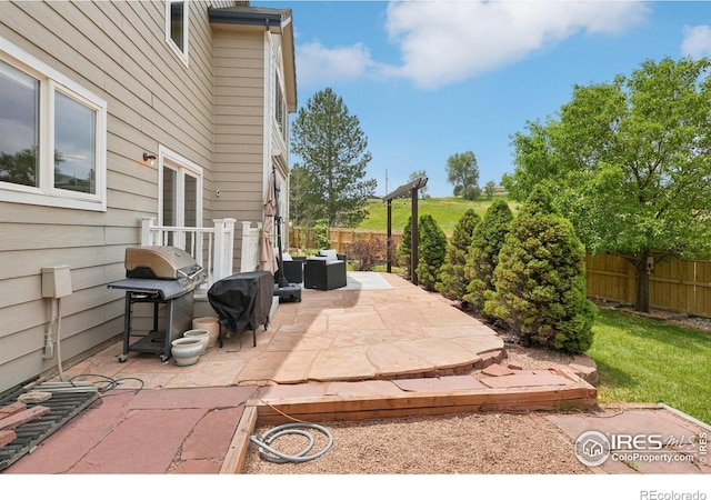 345 Onyx Way, Superior, CO 80027 - fenced backyard with a patio area and a grill